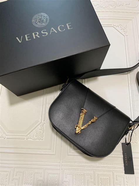 versace virtus saddle bag|Versace quilted leather bag.